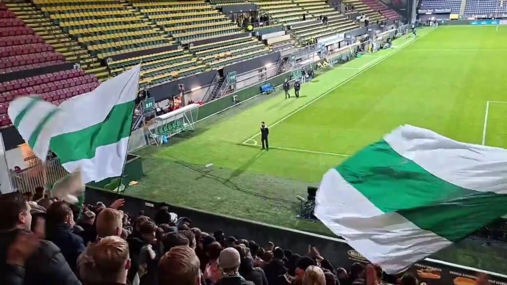Groningen-supporters met vlaggen tijdens een eerdere uitwedstrijd in Sittard